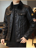 Black snap-front jacket with thick fur collar, chest pockets, and sleeve patch