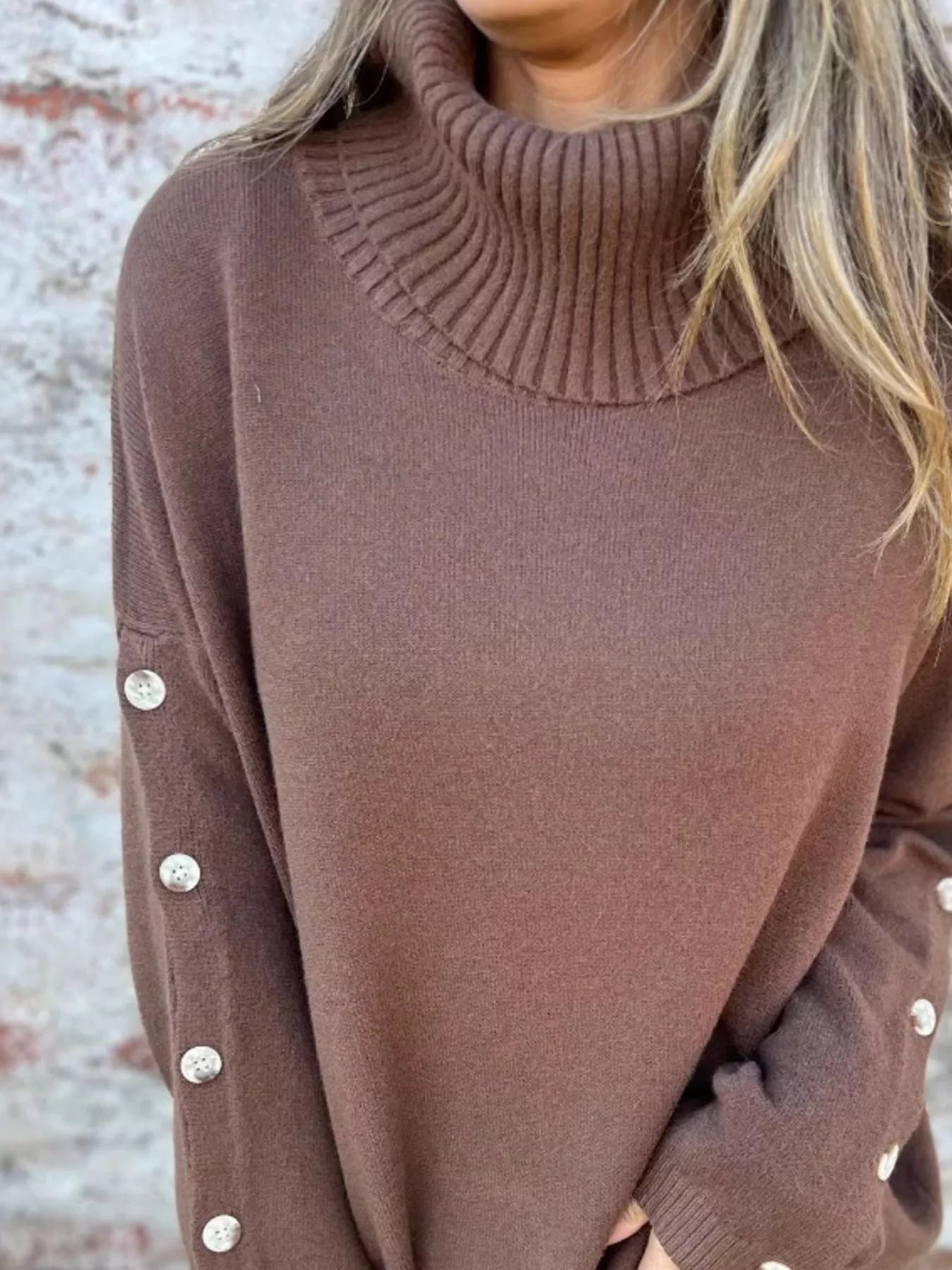 Mocha-brown turtleneck sweater with ribbed collar and long buttoned sleeves