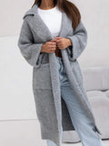 Gray long cardigan sweater with collared neck, dropped shoulders, and side pockets