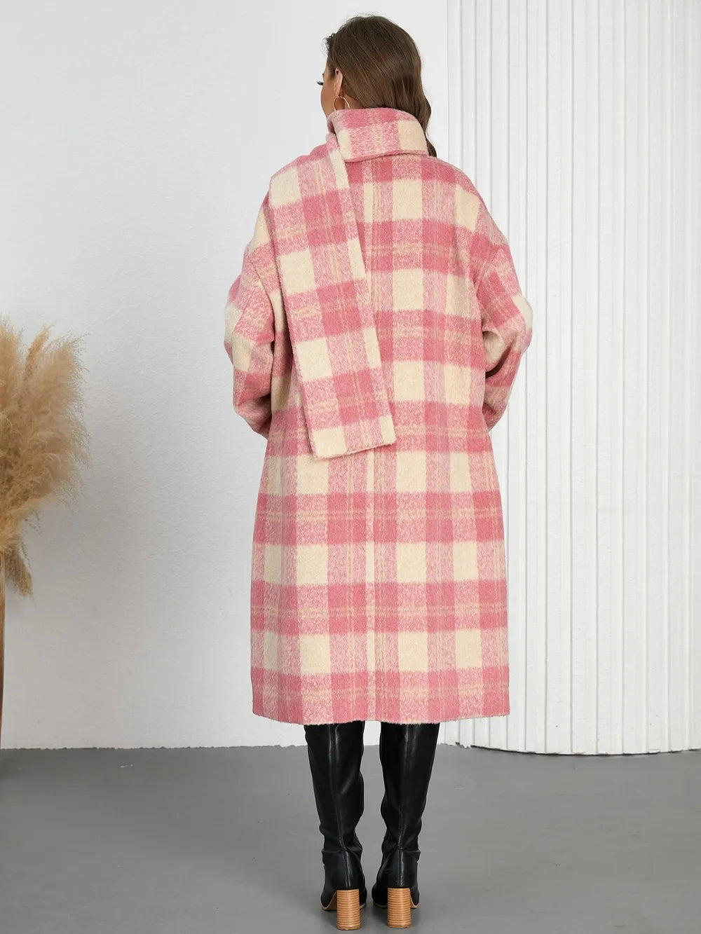 Plaid button-up long coat back view in pink and cream with hooded collar and long hem