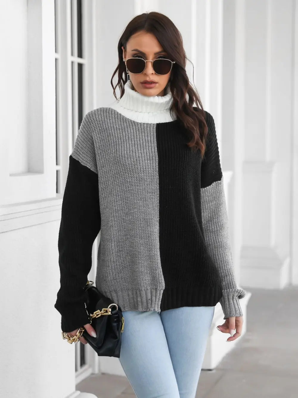 Color-block turtleneck sweater with long sleeves and ribbed cuffs, gray and black color panels.
