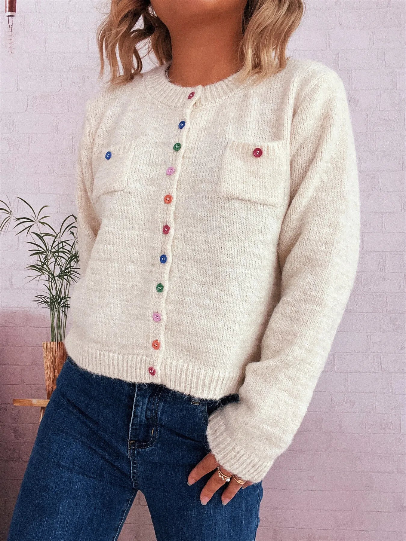 Cream knit cardigan with chest pocket and multicolor button placket, long sleeves