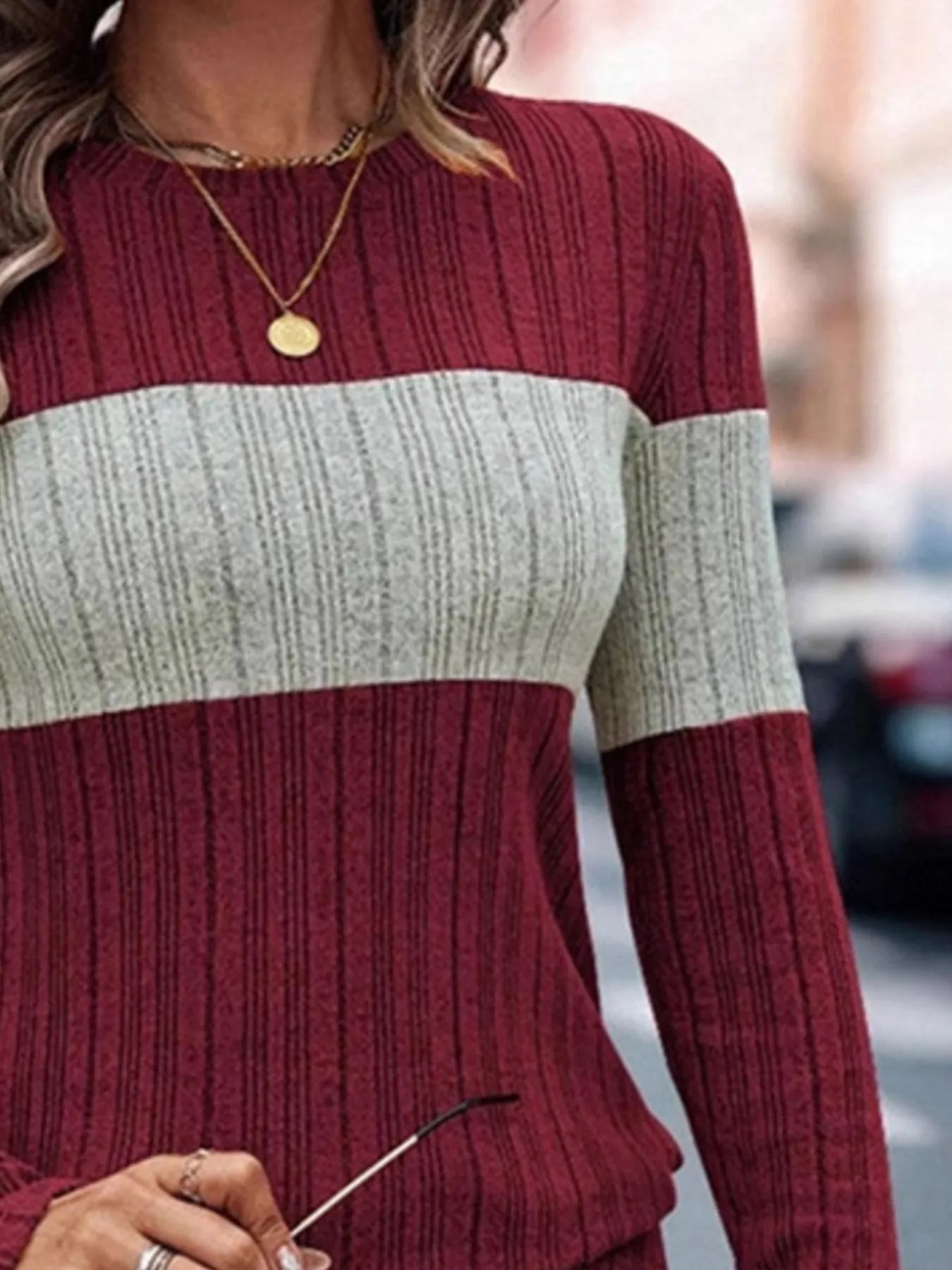 Wine red color-block knit sweater with heathered cream band across the chest