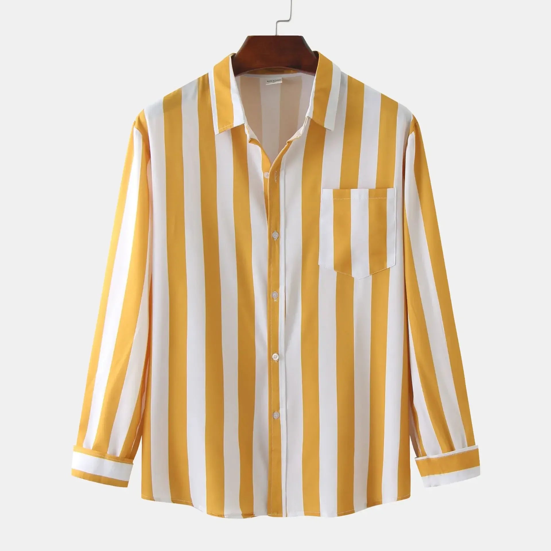 Yellow striped long-sleeve button-down shirt on hanger, button front and chest pocket