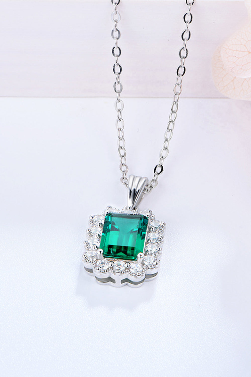 Emerald pendant necklace with green emerald square center framed by diamond accents, 925 silver