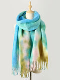 Tie-dye polyester scarf with fringe, pastel blue and green, draped on a mannequin