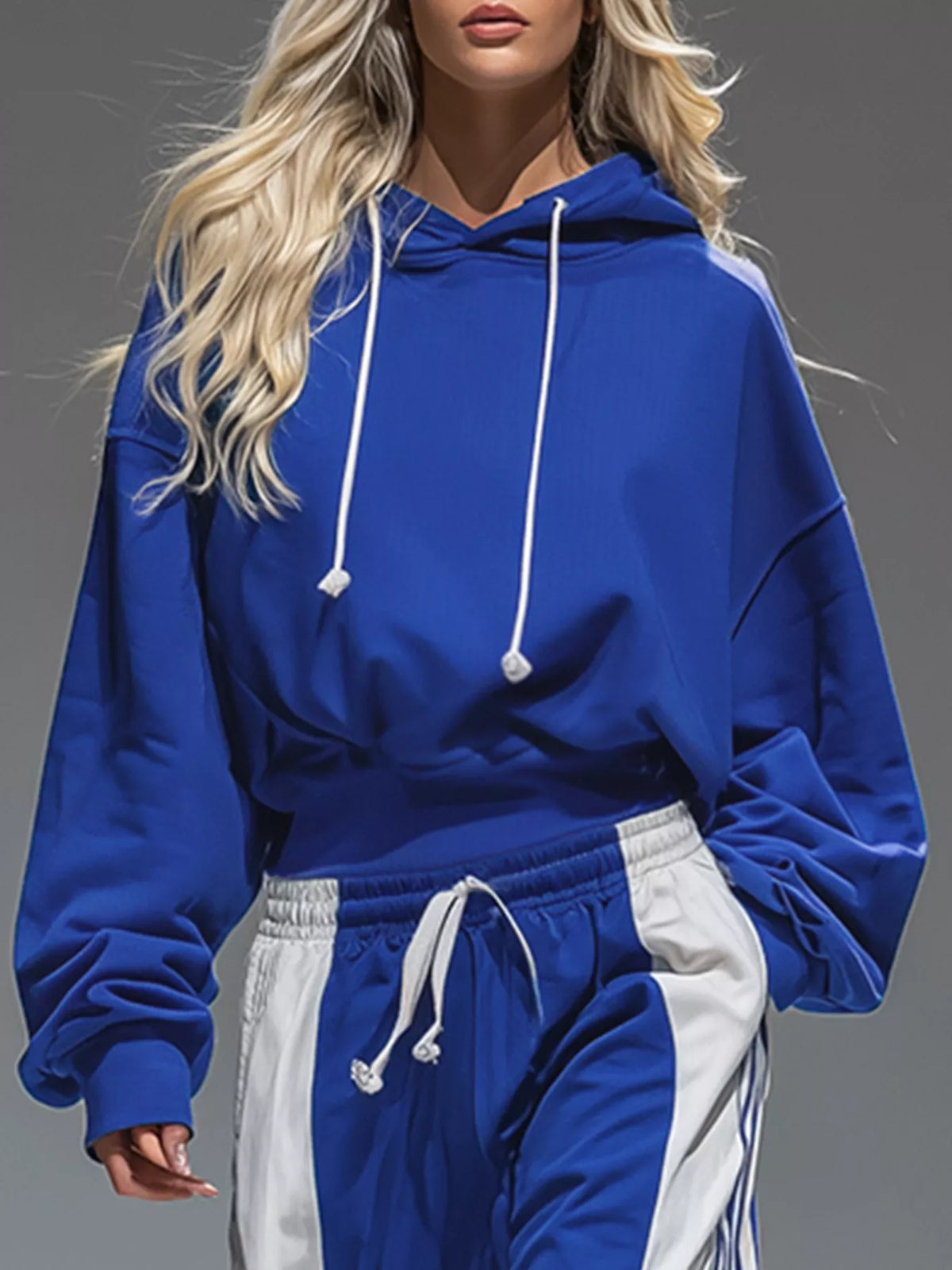 Blue pullover hoodie with white drawstrings and wide-leg pants, elastic waist, side stripes