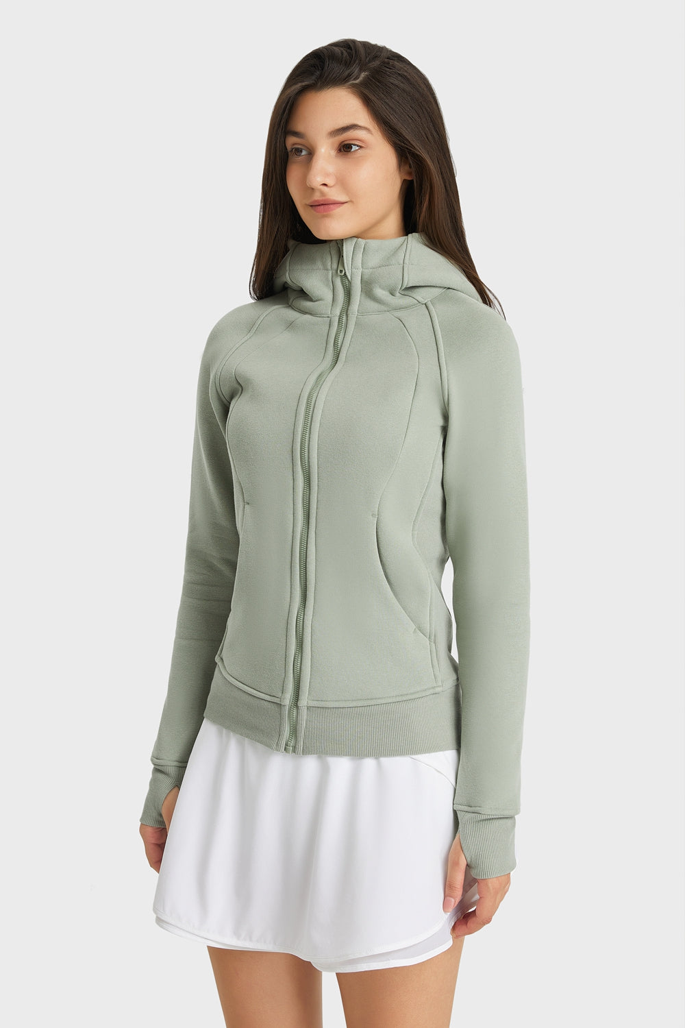 Green zip-up hooded sports jacket with front zipper and seam detail