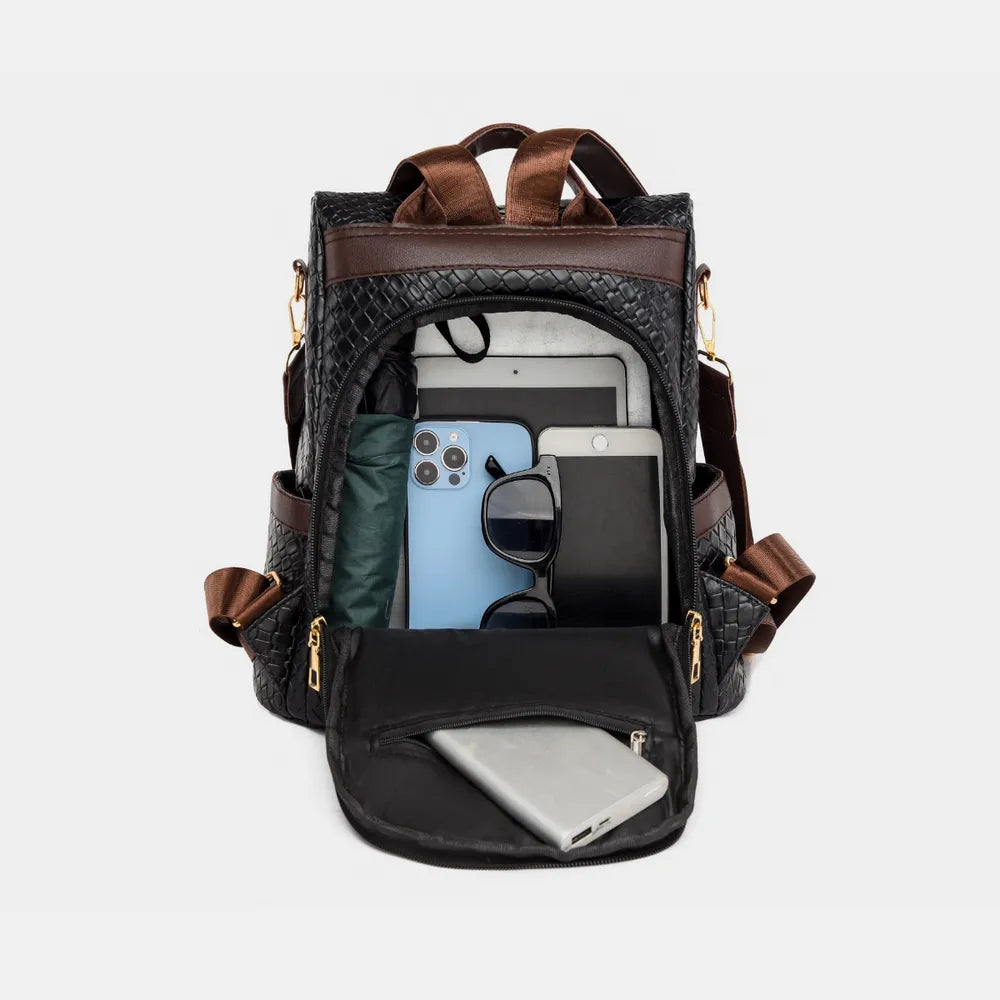 Vegan leather backpack bag with open top showing interior pockets and phone sleeve
