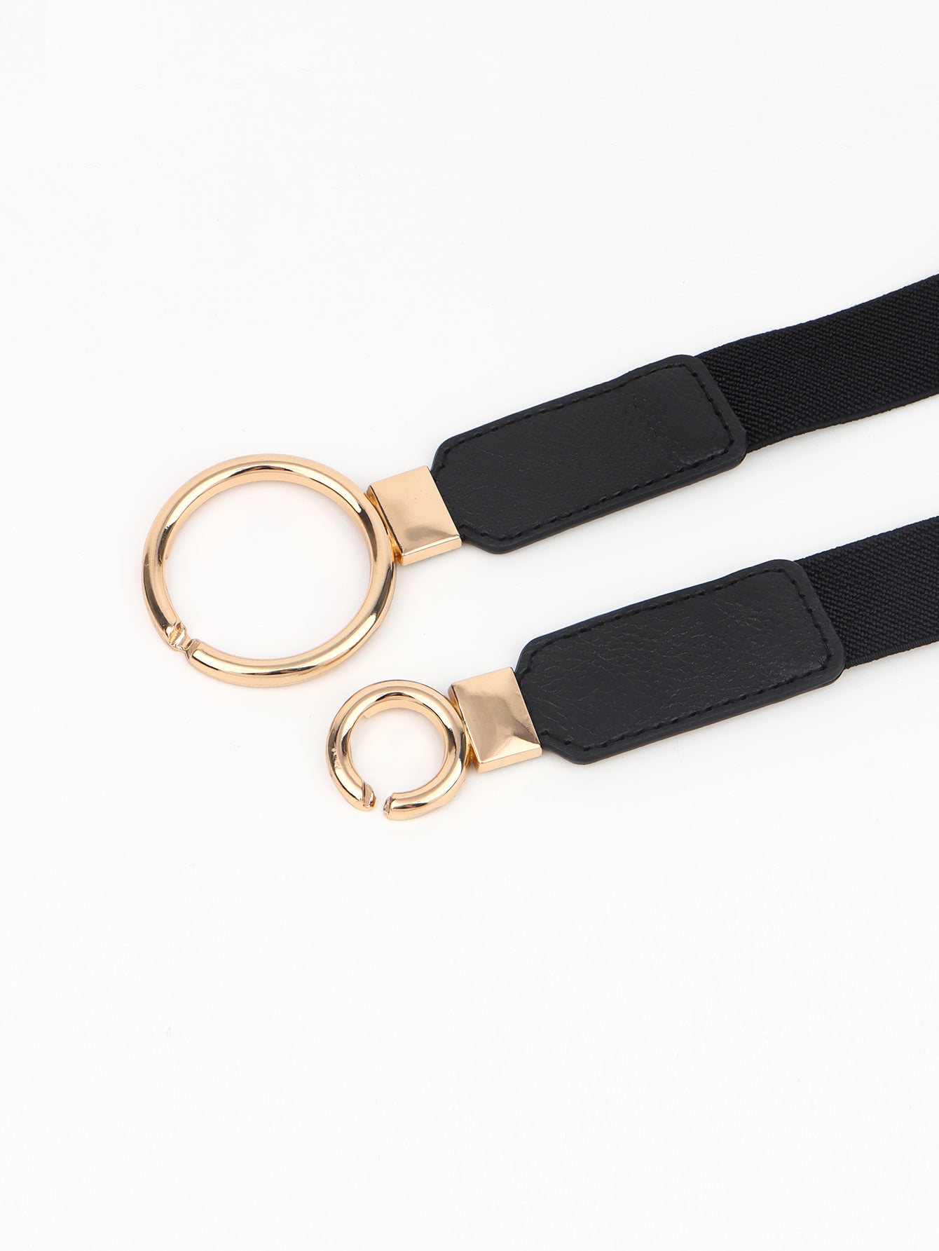 Black elastic belt with double ring buckle and rose-gold rings on adjustable ends
