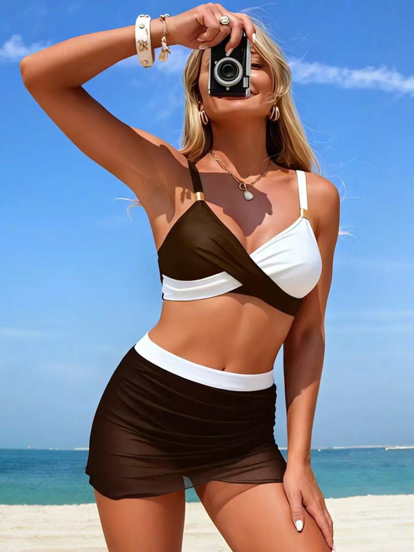 Two Tone Cami and Skort Swim Set by Trendsi, black and white color-block bikini top with a matching black skort.