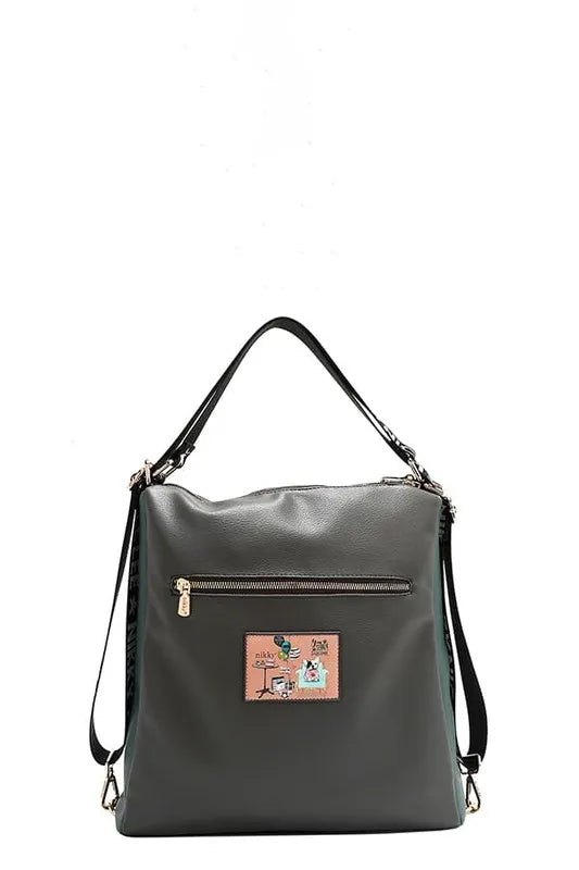 Dark green backpack with rectangular front patch and top grab handles