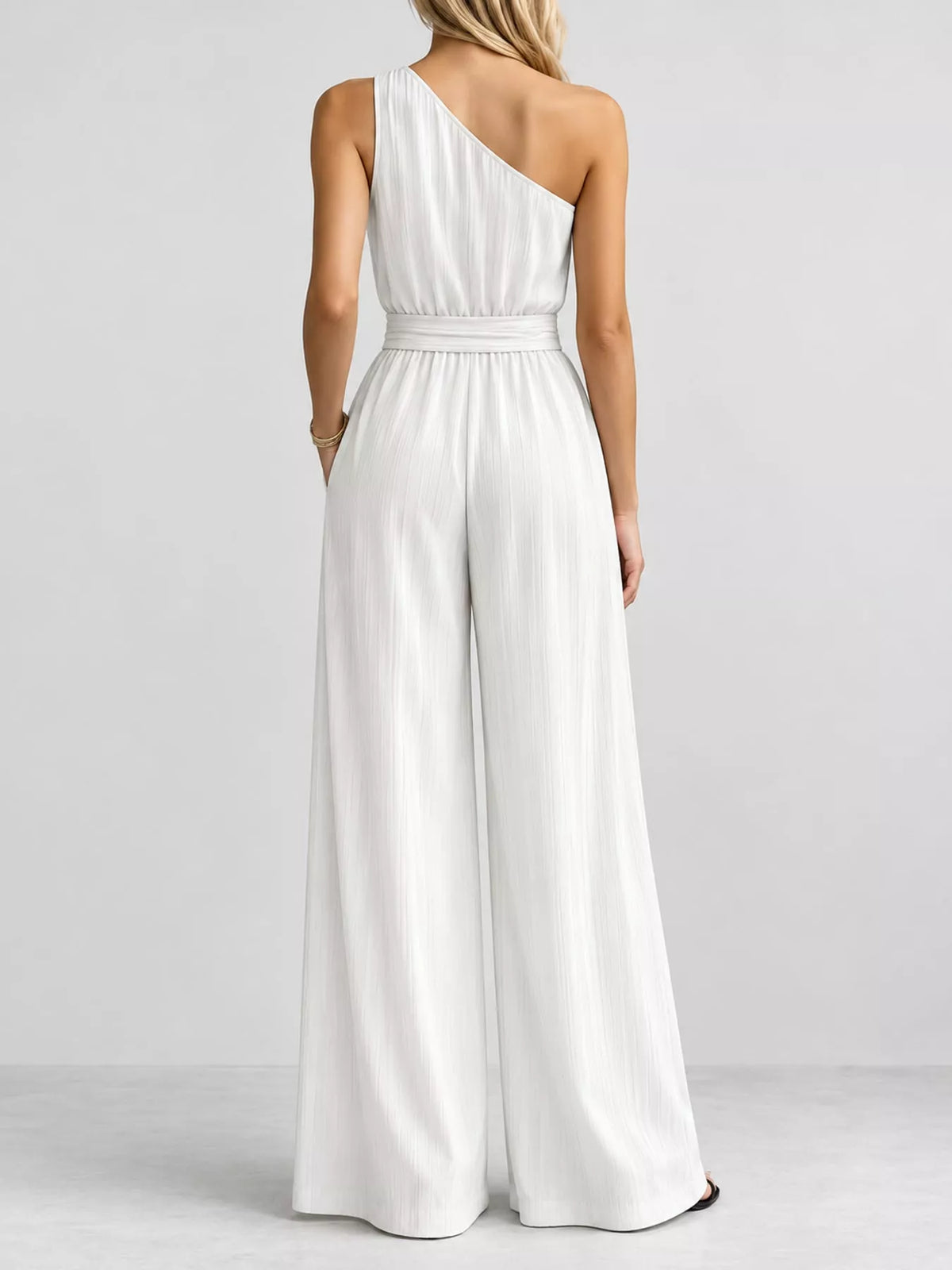 One-shoulder pleated wide-leg jumpsuit, white back view with self-tie waist