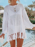 White long-sleeve openwork knit cover up with tassel fringe hem.