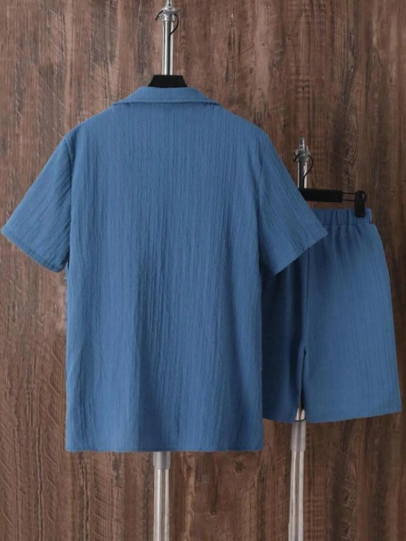 Back of men's plus size blue short sleeve button-up shirt and matching shorts set
