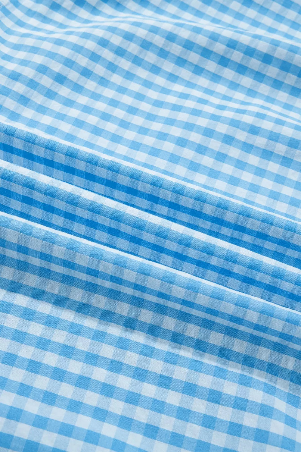 Cedar & Moore Knot Back Ruffled Short Sleeve Gingham Maxi Dress fabric in blue gingham check