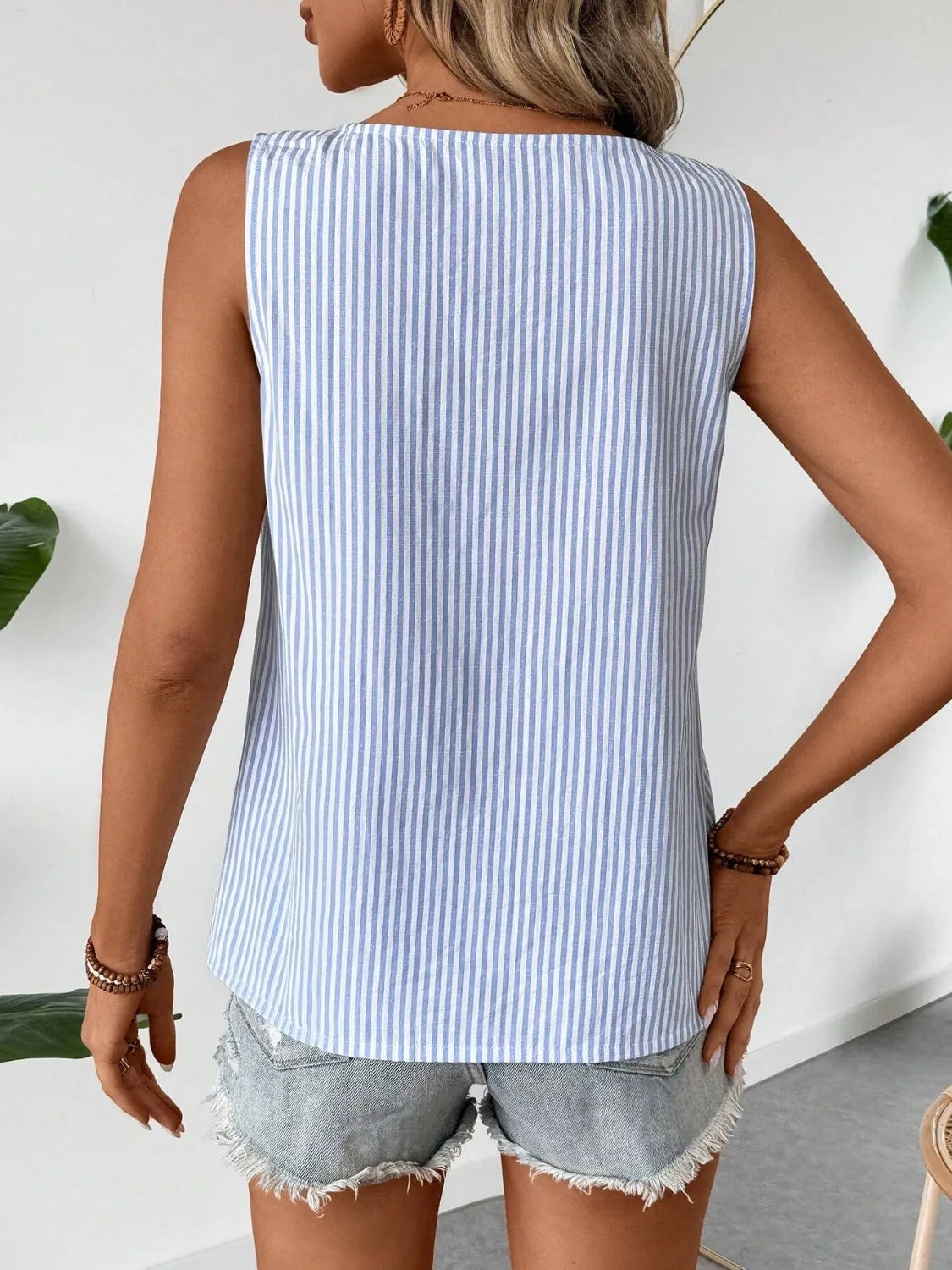 Back view of light blue striped sleeveless tank top
