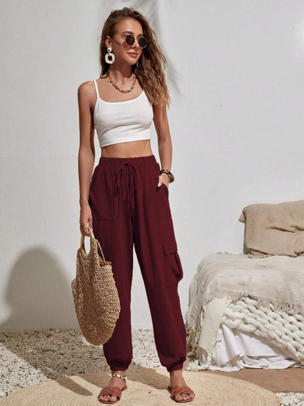 Burgundy drawstring cargo joggers with side cargo pockets and gathered waistband