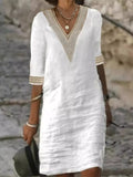 White V-neck lace-trim half-sleeve dress with matching lace cuffs and simple shift fit
