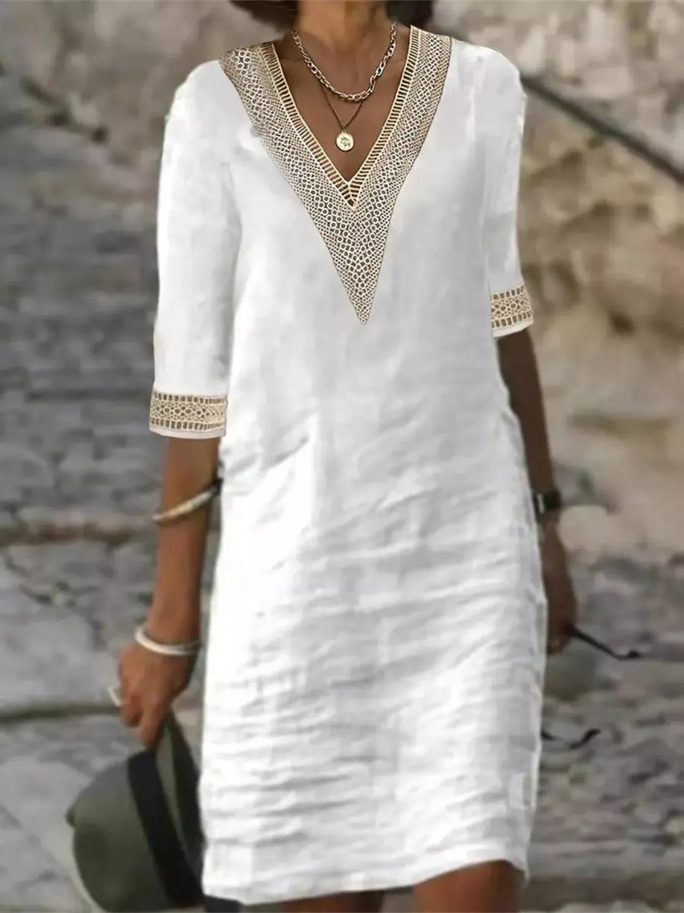 White V-neck lace-trim half-sleeve dress with matching lace cuffs and simple shift fit
