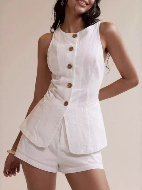 White sleeveless button-down peplum top and matching shorts set