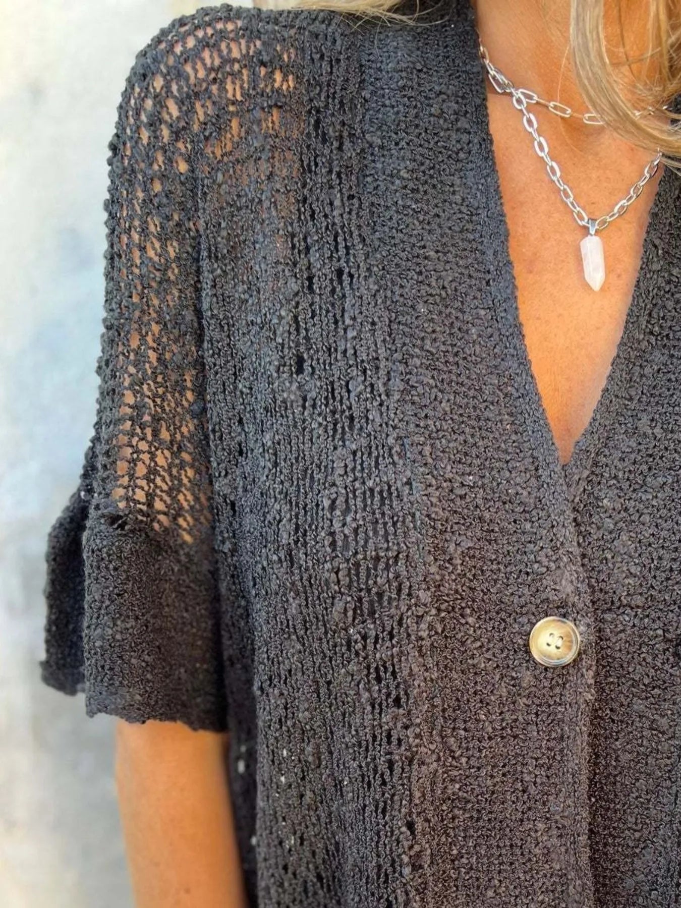 Dark brown open-knit one-button half-sleeve cardigan with V-neck and textured fabric