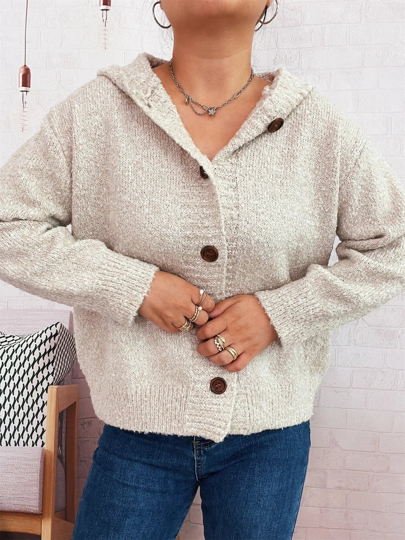 Cozy hooded cardigan, cream knit with dark brown buttons and hood.