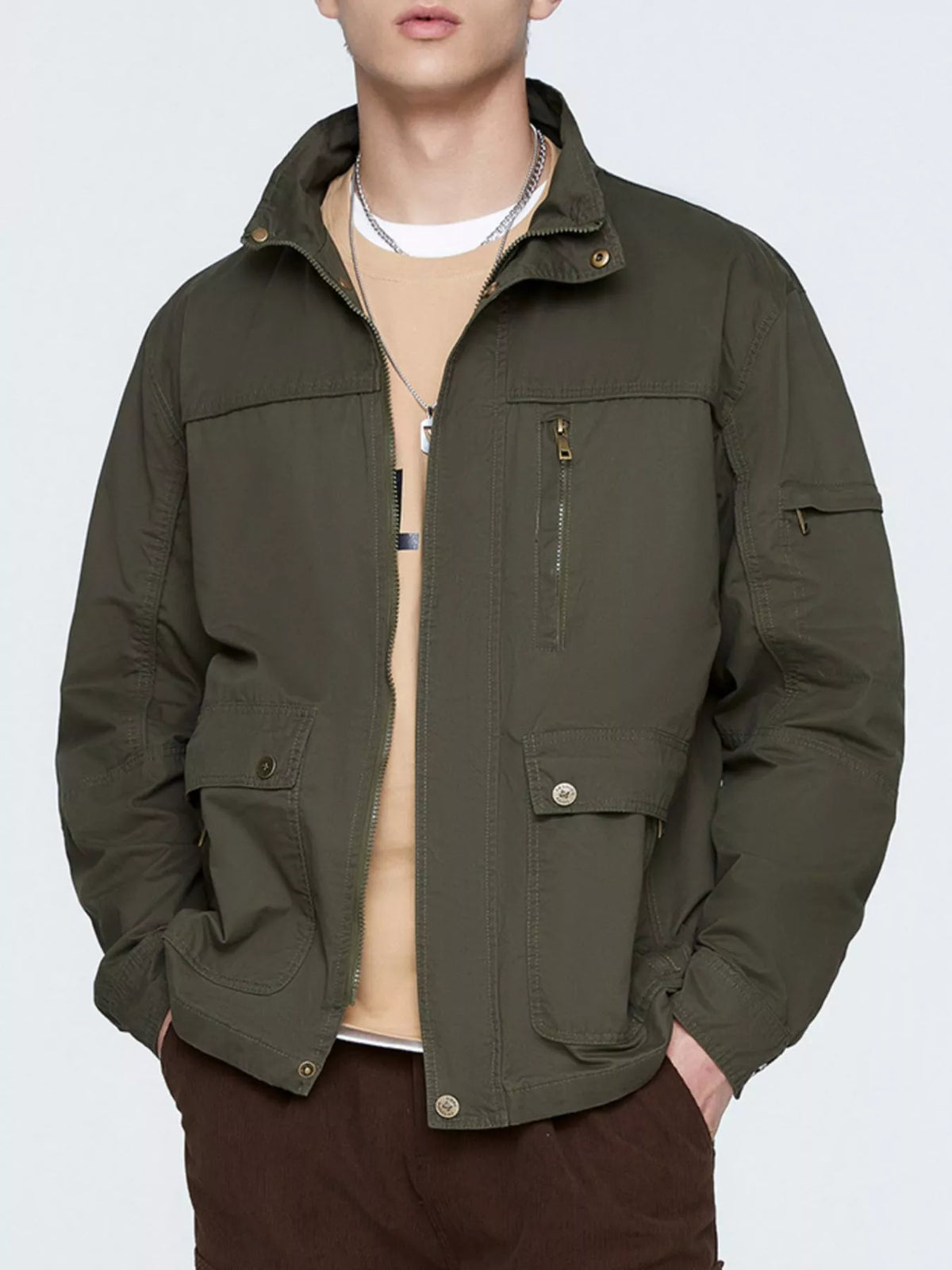 Army green zip-up lightweight jacket with stand collar and chest zipper pocket