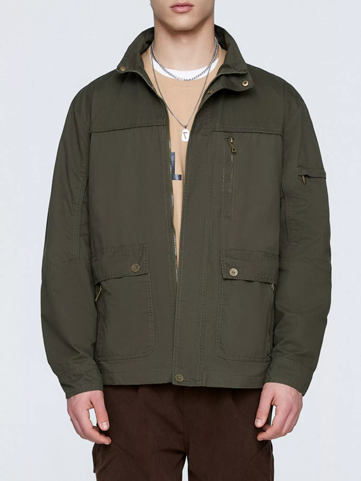 Army green zip-up jacket with snap button pockets and sleeve chest zipper