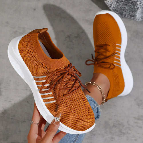 Orange breathable mesh lace-up sneakers, angled toe and side profile