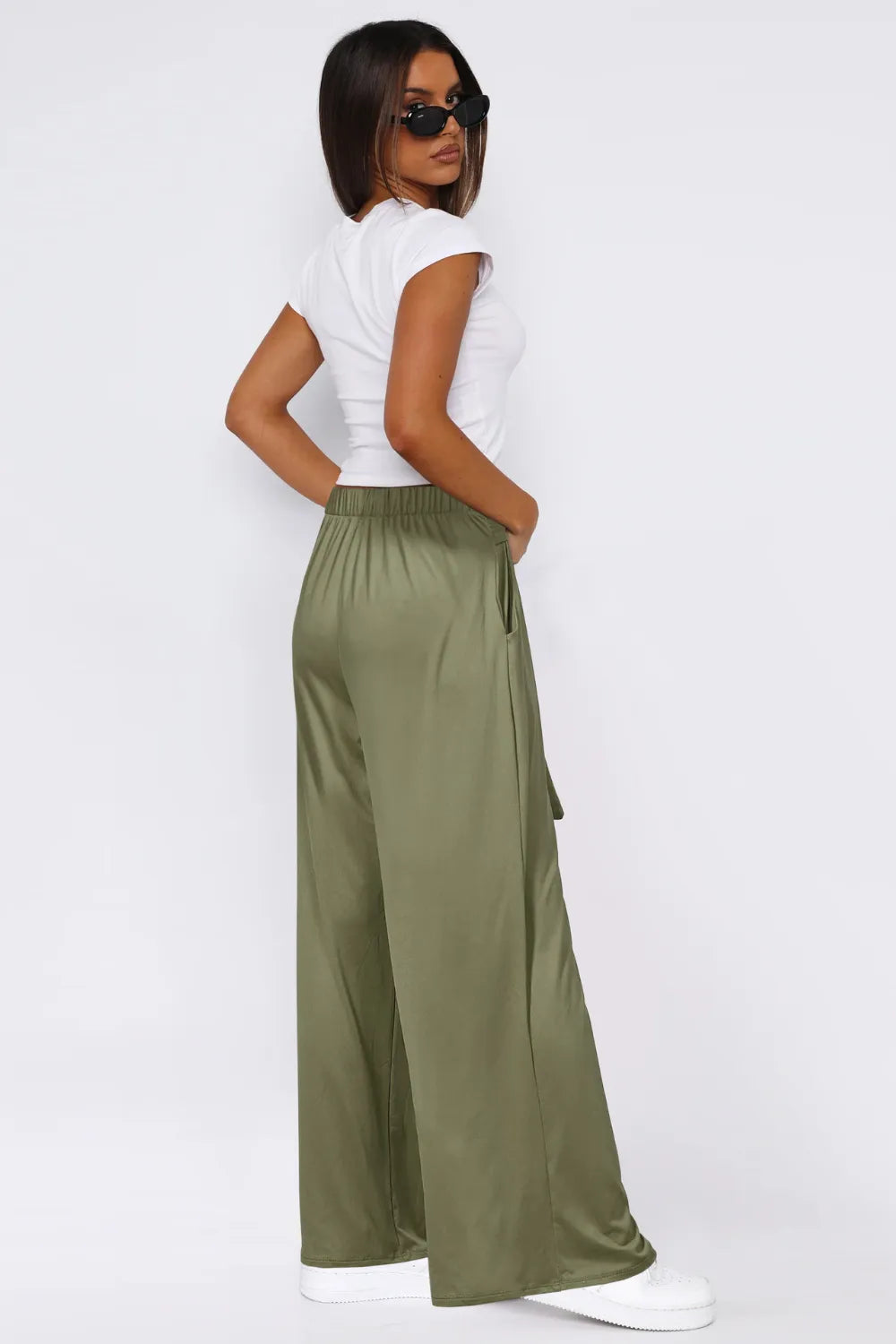 Moss green wide-leg pants with tied waist and side pockets, full-length wide legs.