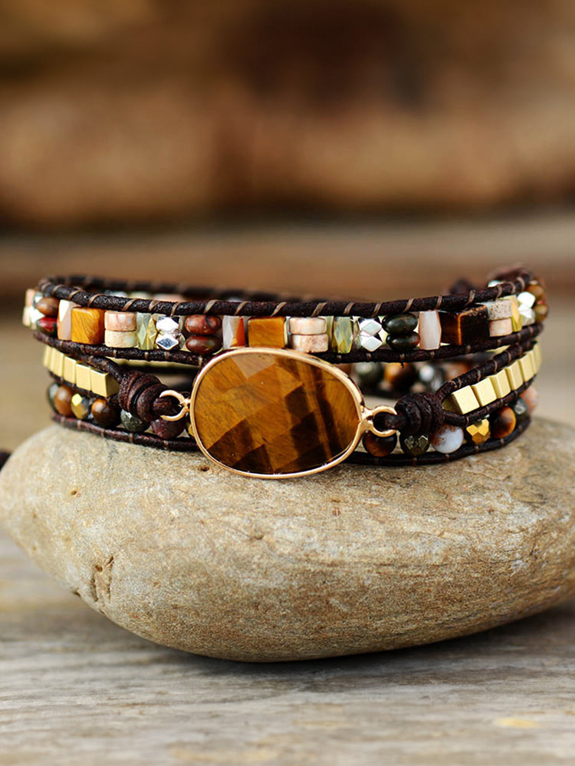 Triple-layer beaded bracelet with oval wood centerpiece and mixed stone-like beads