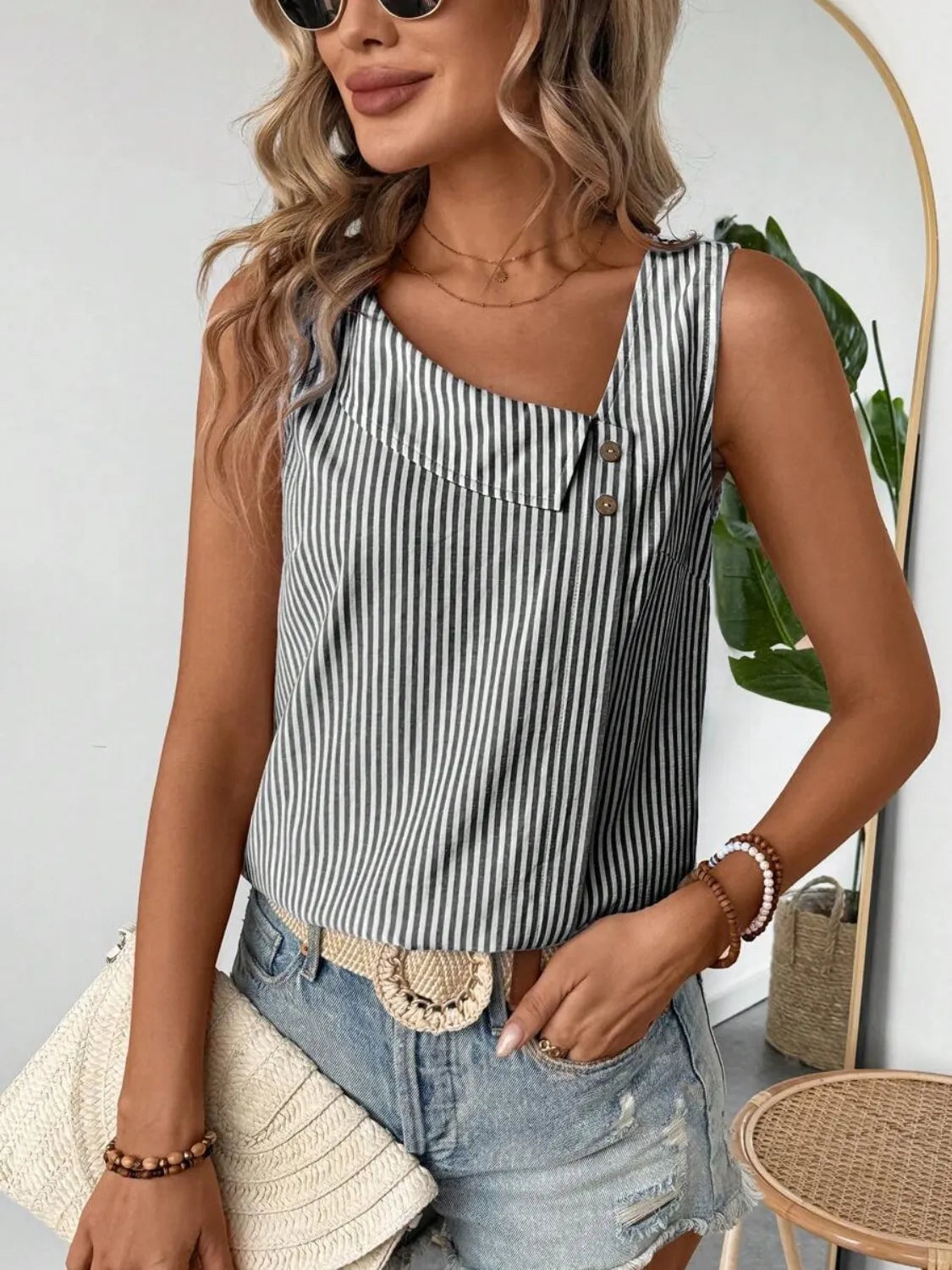 Light blue and white striped sleeveless tank with central button closure and scoop neckline