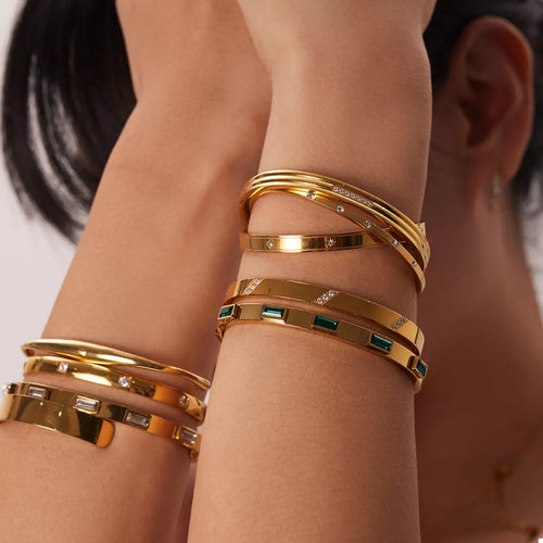 Gold-plated zircon bracelet cuff with green square accents and clear crystal details