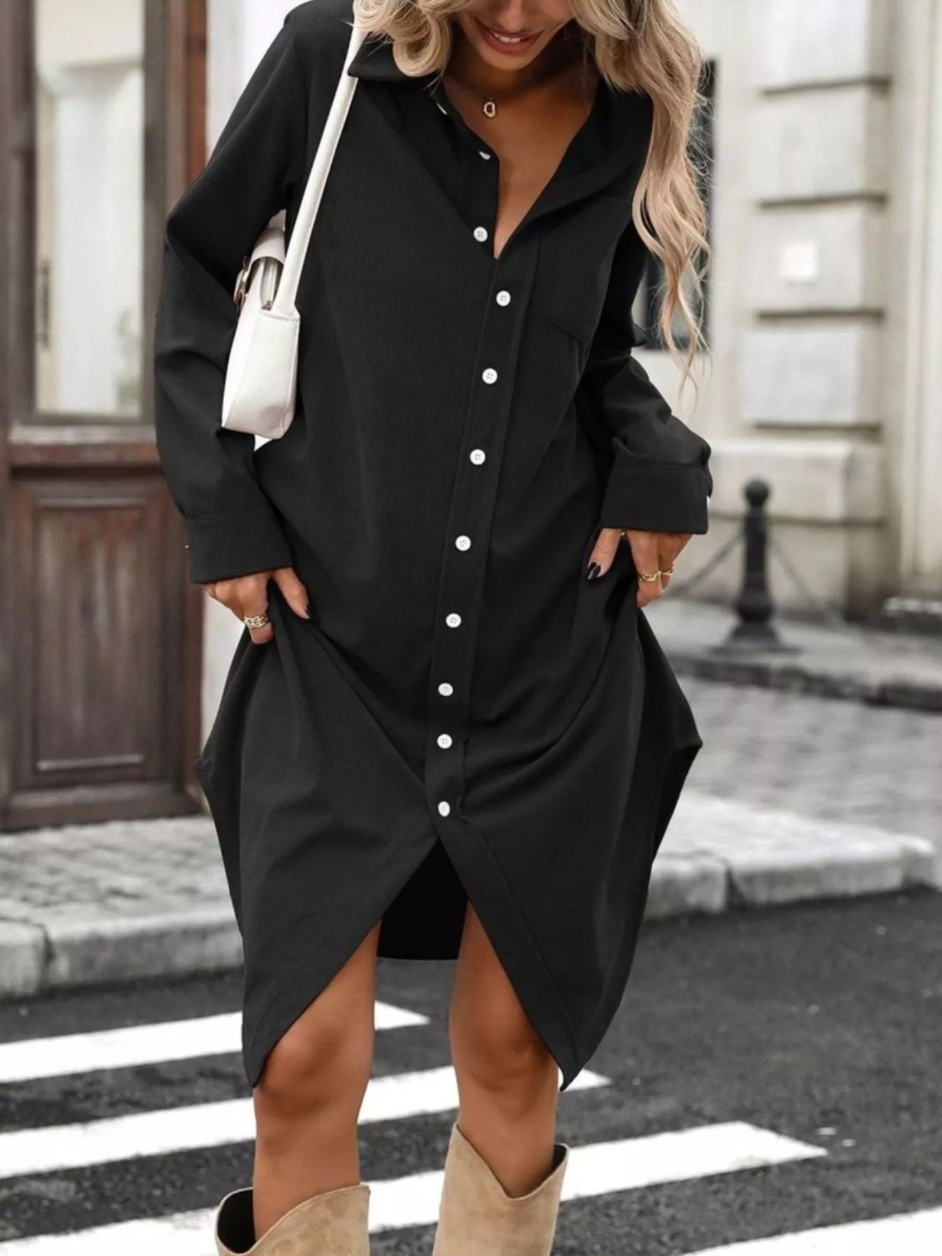 Black corduroy shirt dress with button front, point collar, long sleeves, side slit