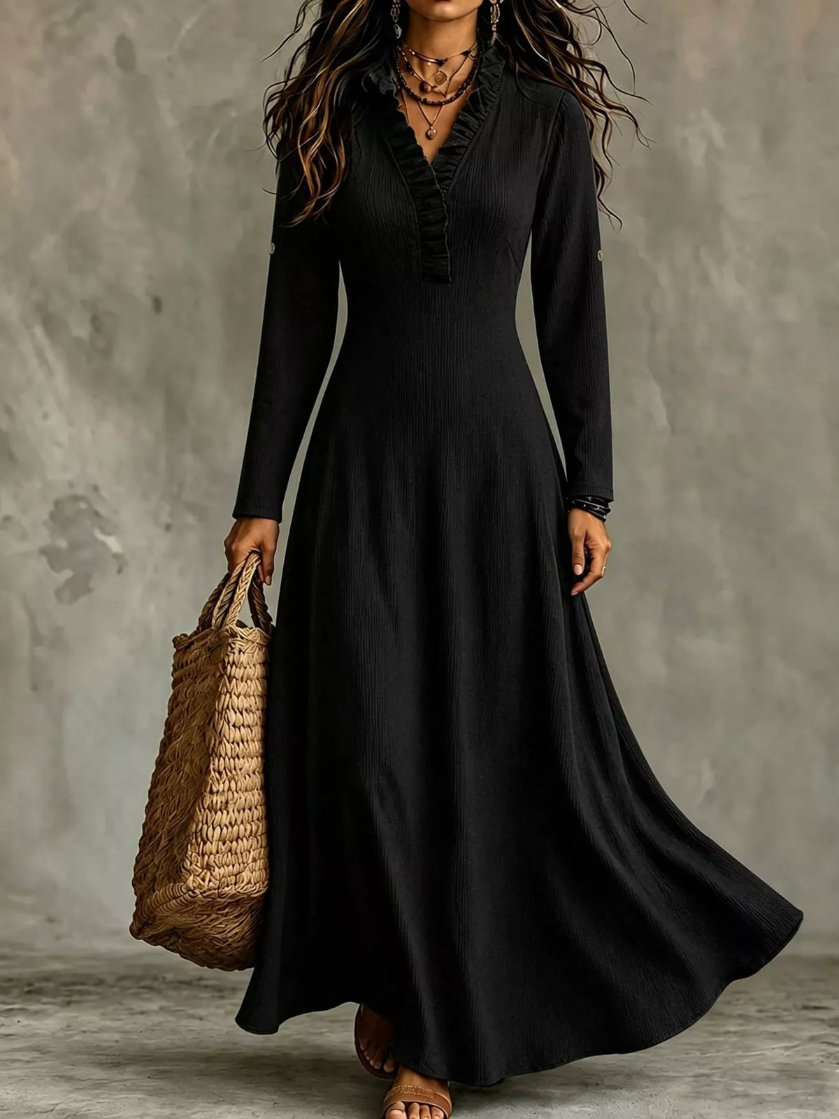 Black V-neck maxi dress with ruffled trim and long sleeves; swishy A-line skirt