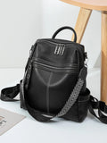 Black leather backpack bag with front zip pocket, top handle, adjustable strap