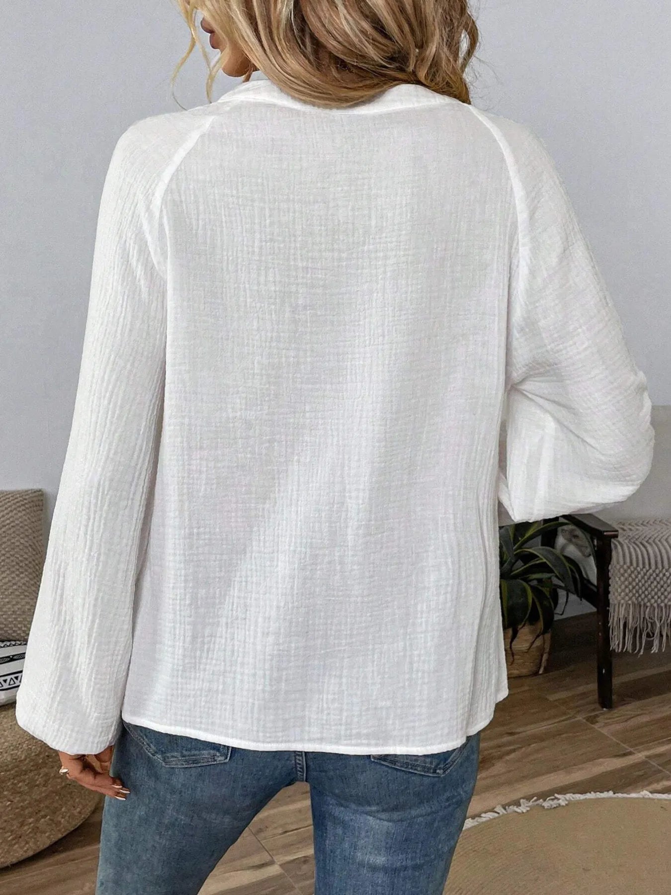 Long-sleeve blouse, white back view with loose fit and V-notch seam details