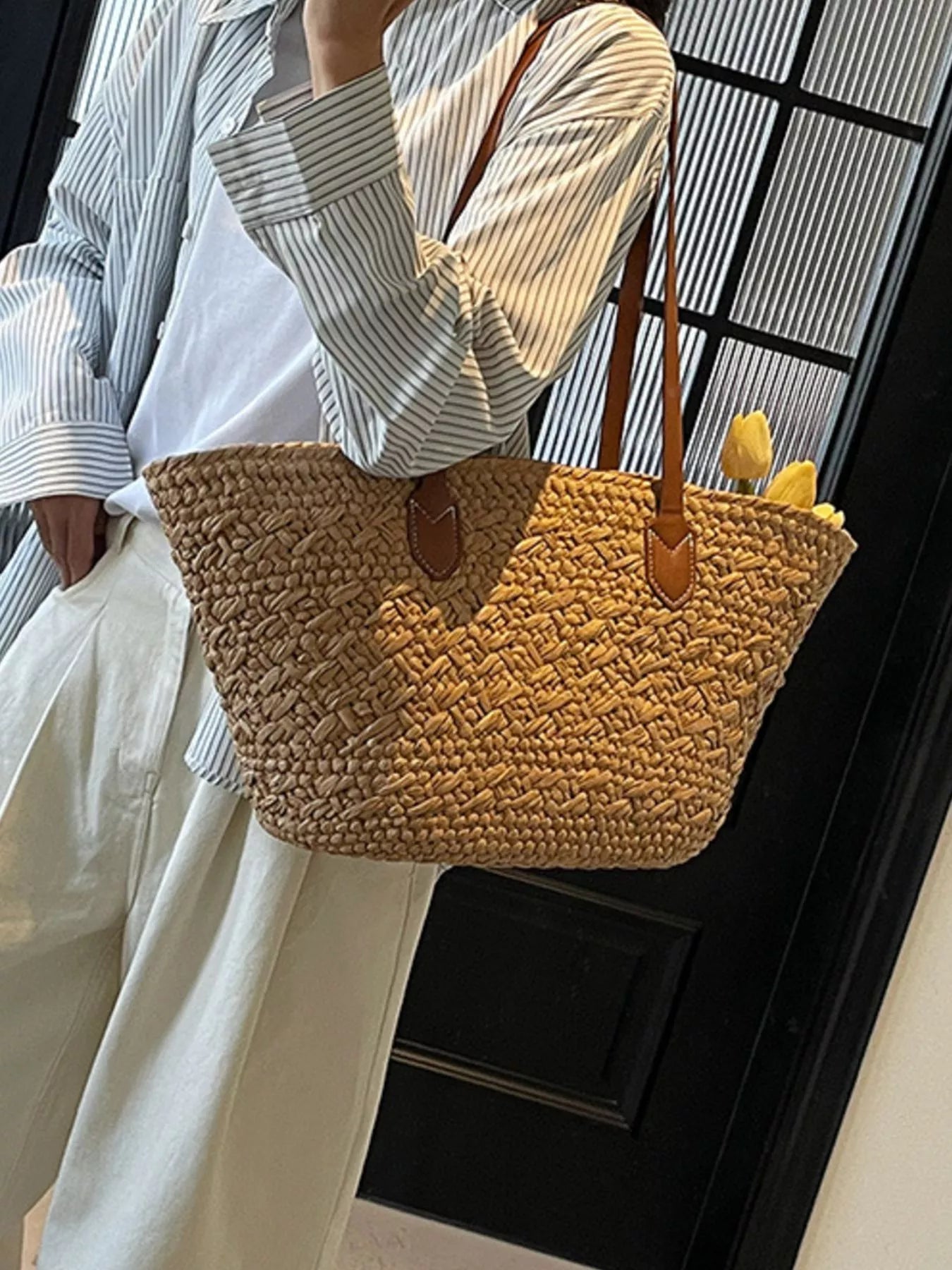 Caramel woven tote shoulder bag with brown leather straps and front stitched details