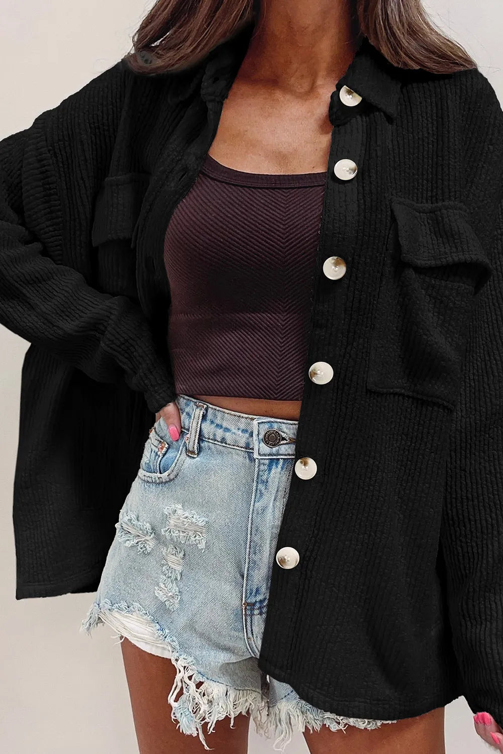 Black button-up long sleeve shacket with flap pockets, point collar, and front metal buttons