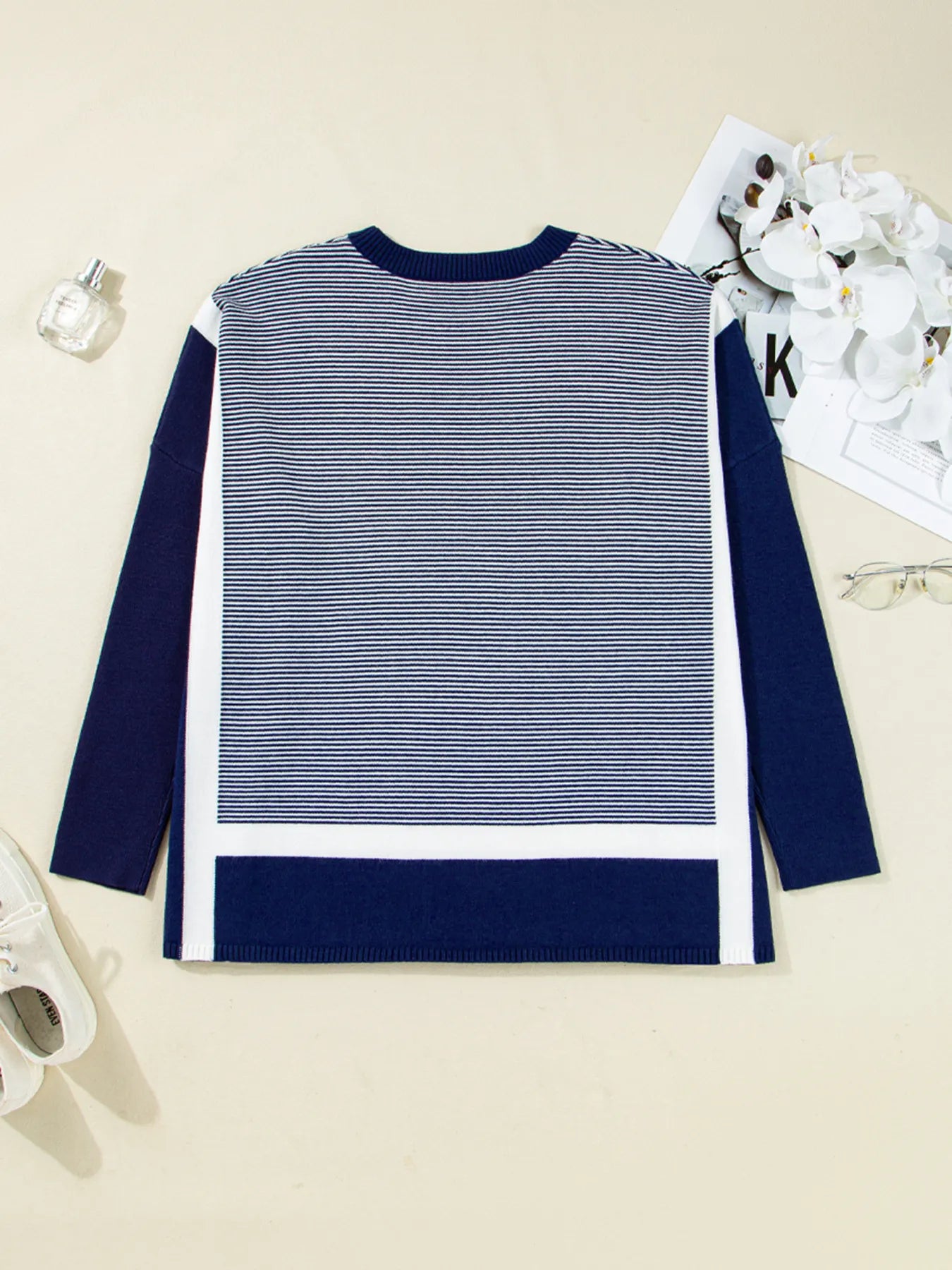 Navy and white striped knit tunic sweater with ribbed hem band and long dolman sleeves