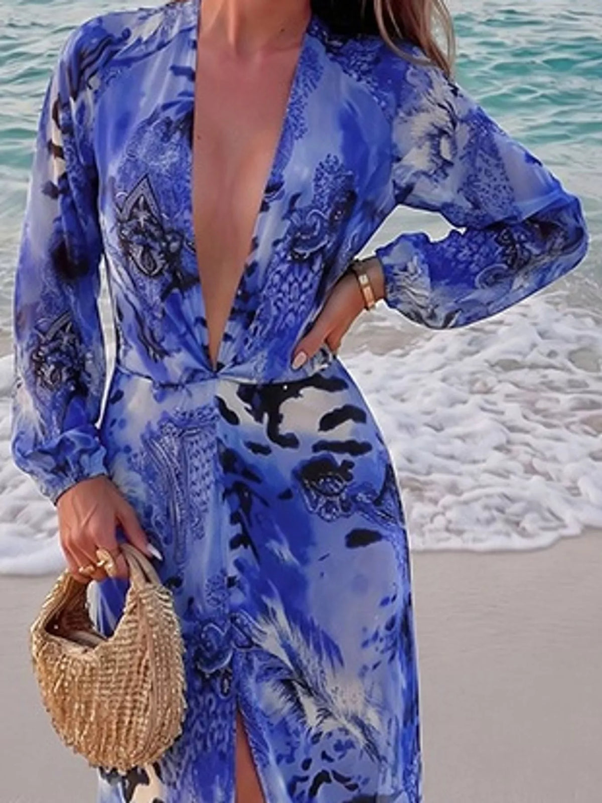 Blue printed flowy maxi dress with deep V neckline and long balloon sleeves