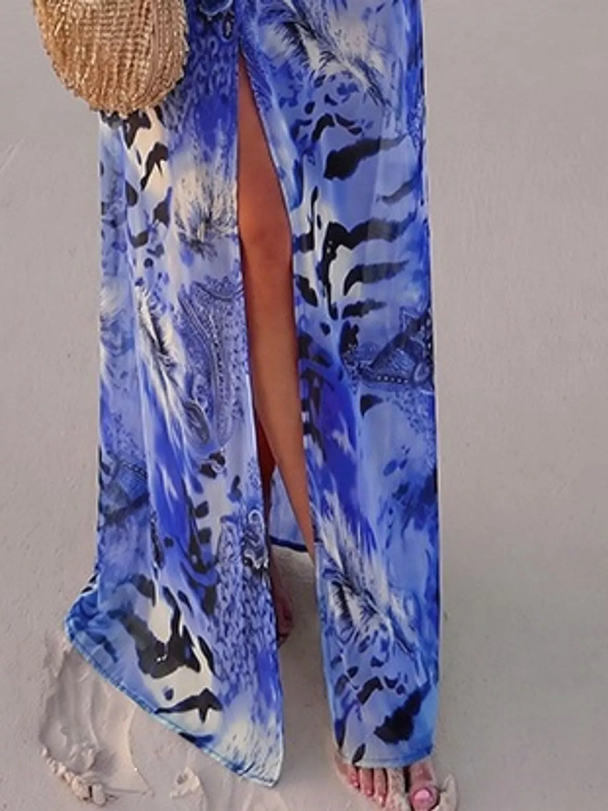 Blue printed maxi dress with side slit and flowing hem, long sleeves