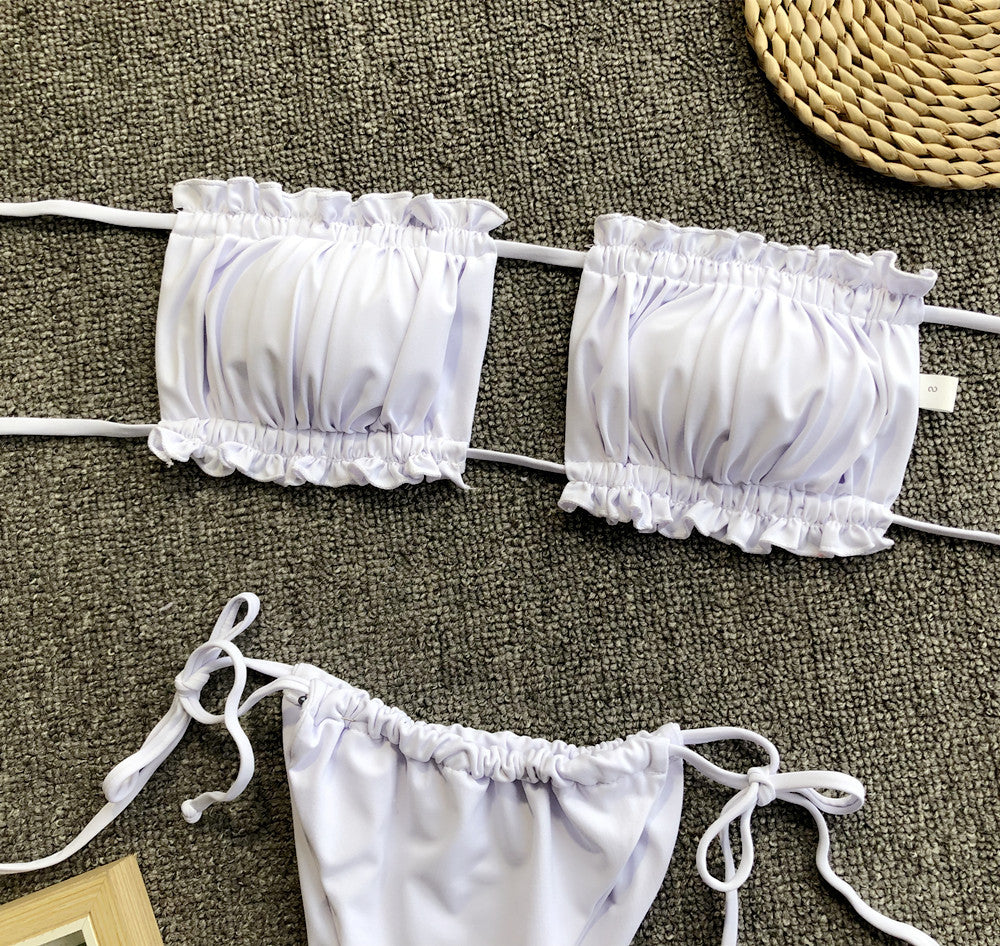White frill-trim ruched bandeau bikini top set with matching tie bikini bottoms