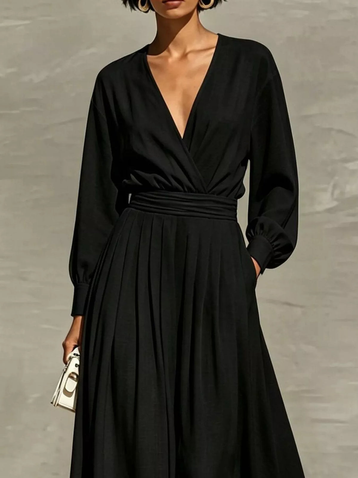 Black long-sleeve wide-leg jumpsuit with V-neck and gathered waist