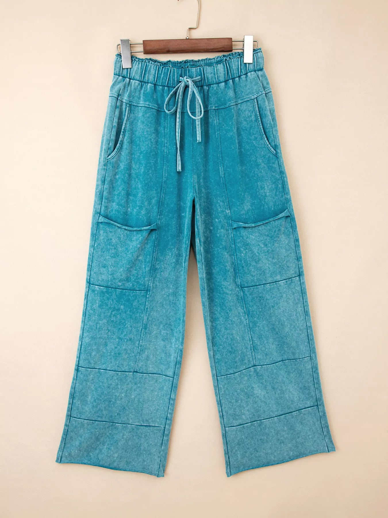Teal mineral-wash wide-leg pants with drawstring waist and patch pockets