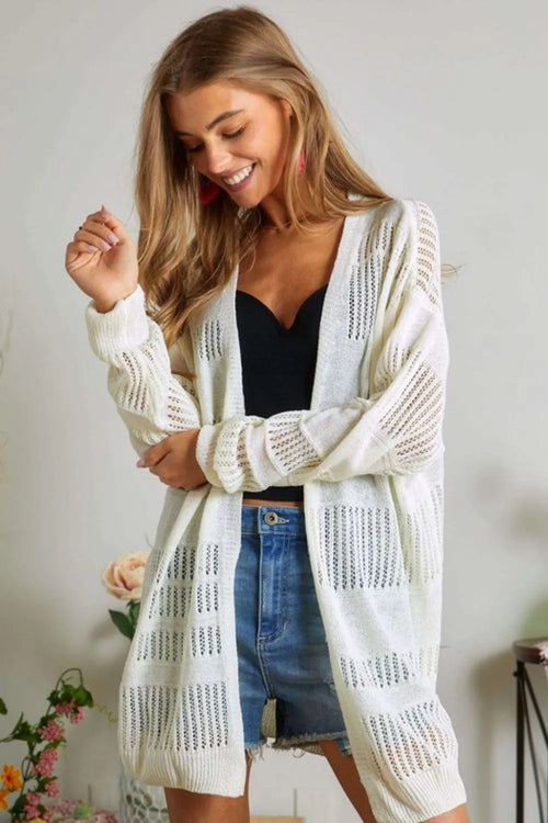 Ivory lightweight knit cardigan with open front, long sleeves, and textured stitch detail