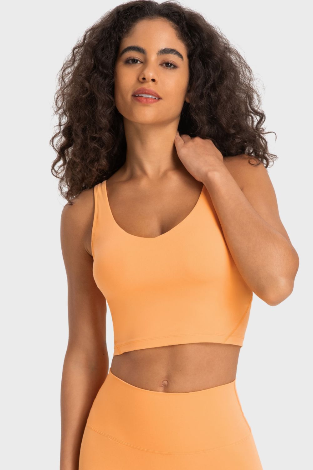 Orange crop sports bra with deep V-neck and racerback straps