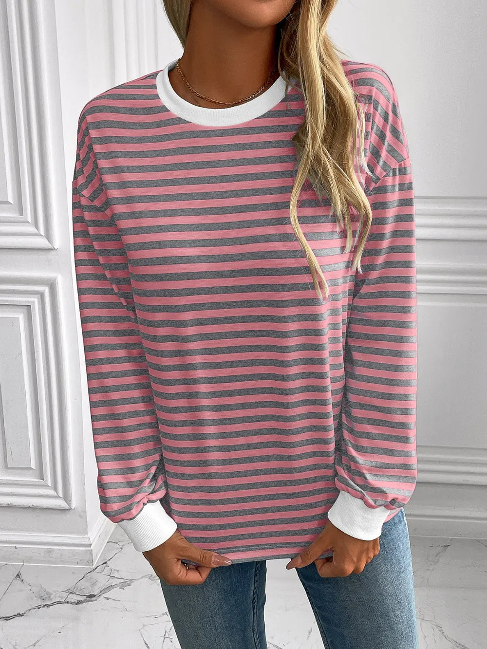 Striped long-sleeve sweatshirt with round neck, dusty pink and dark stripes, relaxed fit