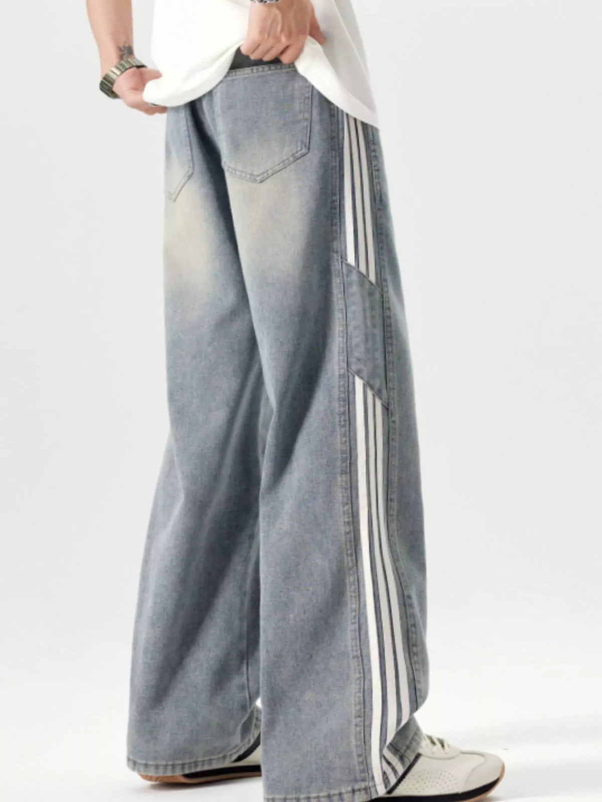 Washed blue wide-leg jeans with drawstring waist, back yoke seam, side stripe panel